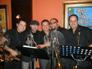 Isaac Delgado's horn section